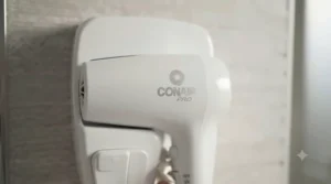 Durable ABS plastic hotel style wall mounted hair dryer for busy guest rooms.