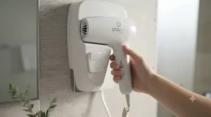 Ergonomic hotel style wall mounted hair dryer with easy-grip handle.