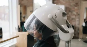 Ergonomic design of a salon hood dryer for client comfort.
