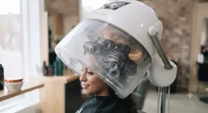 Using a professional salon hood dryer for deep conditioning.