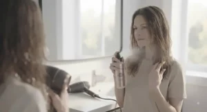 A stylish hair dryer for damaged hair resting on a vanity in a contemporary Canadian home bathroom.