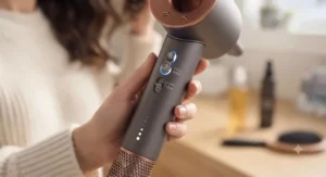 Illustration of a hair dryer for dry hair featuring low-heat and cool-shot settings for gentle styling.