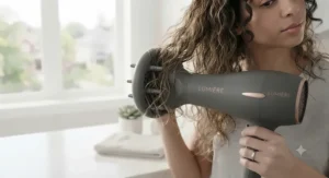Ceramic hair dryer equipped with a diffuser attachment gently drying wavy and damaged hair.