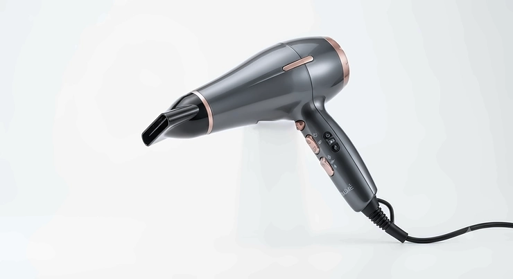 Sleek root-lifting hair dryer shown against a clean white background, designed for volume and styling.