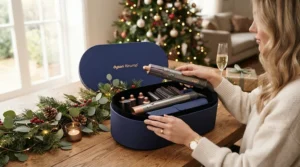 A professional ceramic hair dryer unboxed as a holiday gift on a festive wooden tabletop in Ottawa.